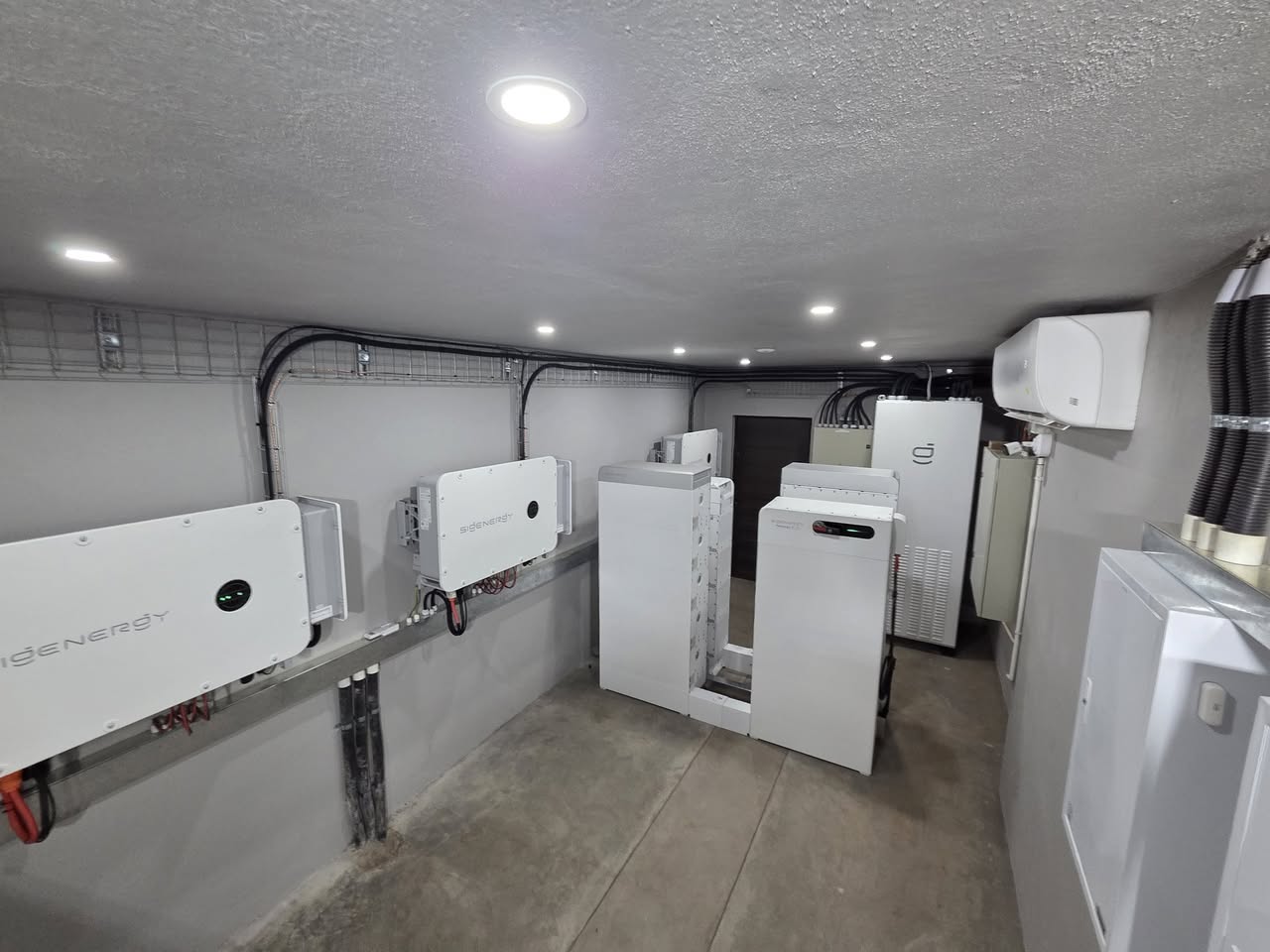 Sigenergy inverters and battery storage in the complex’s dedicated equipment room